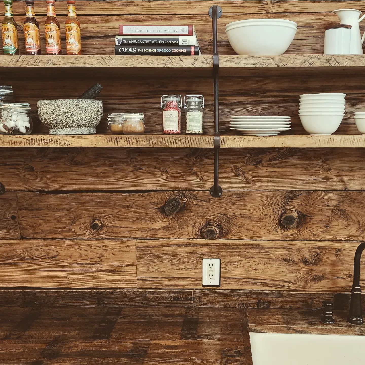 Wooden wall with wooden shelves.