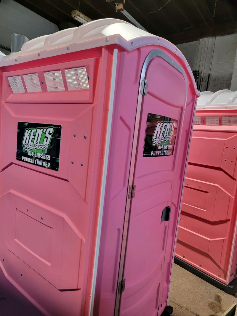 Two pink portable toilets.