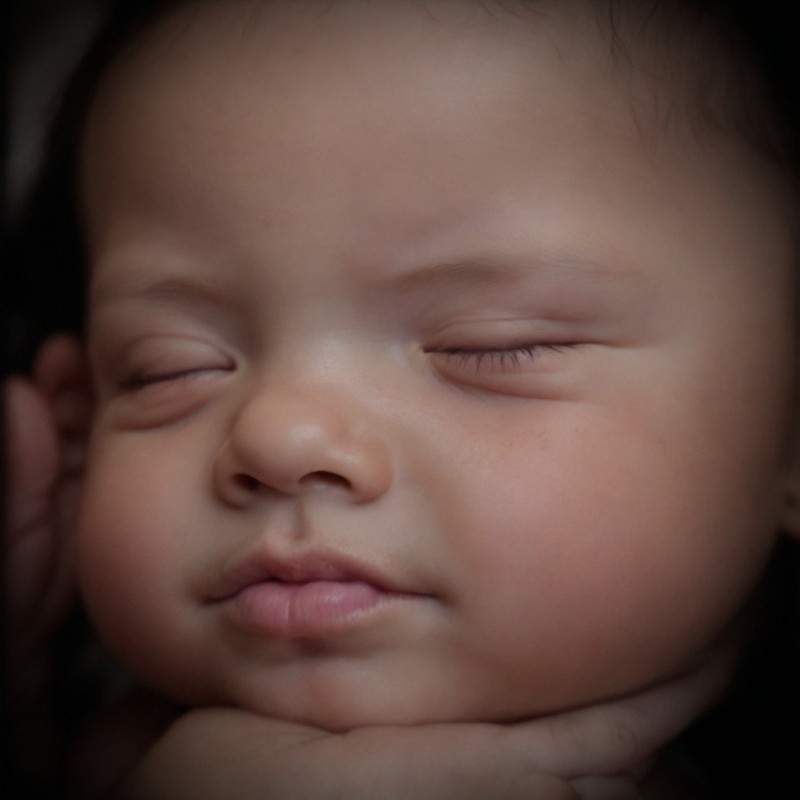Higher resolution 8k Ultrasound enhancement showing baby's face in tans and pinks