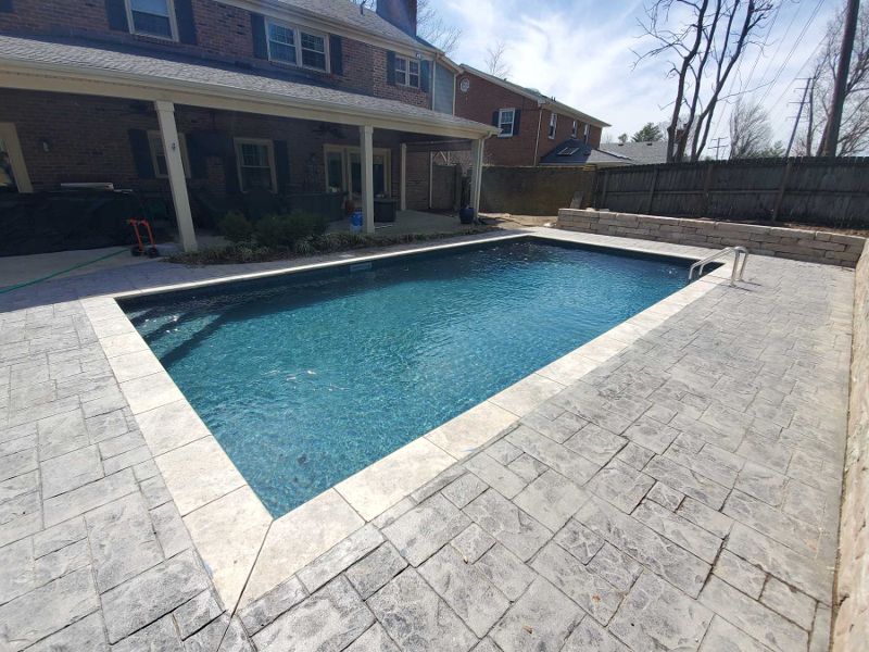 An overhead view of a backyard swimming pool