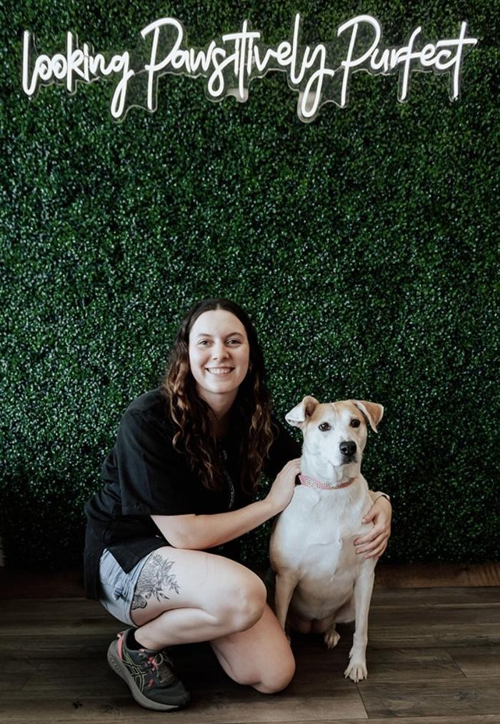 Kylie posing with a dog