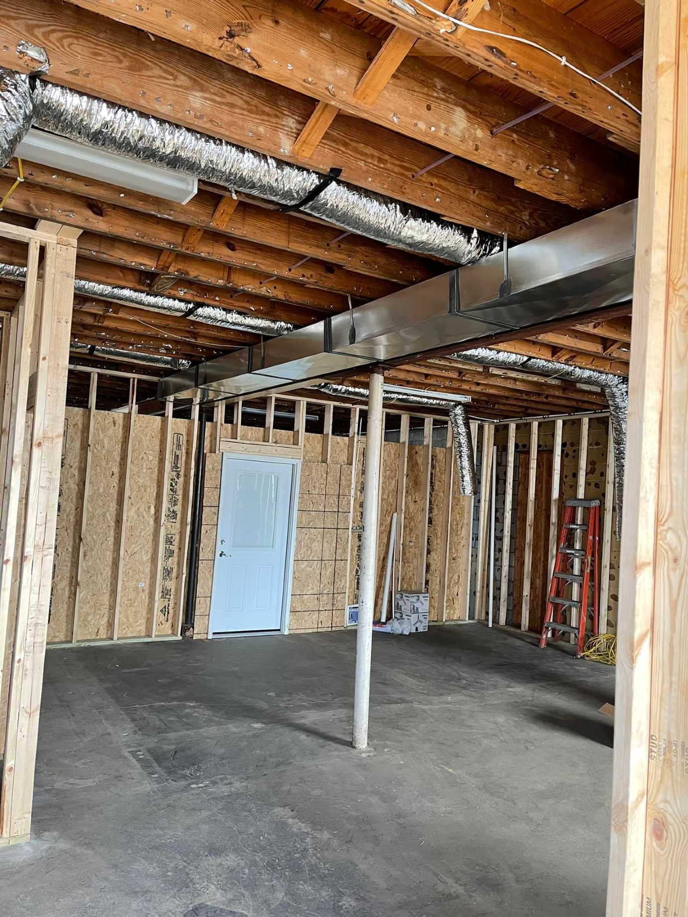 Home's insulation in an unfinished basement.