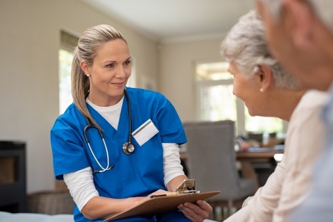 Care worker talking with senior residents