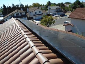 Solar panels on a clay tile roof. 