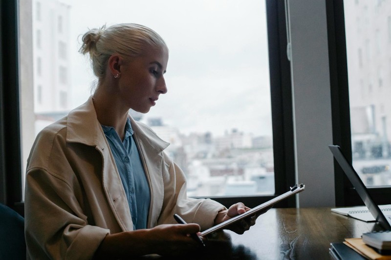 woman concentrating on documents