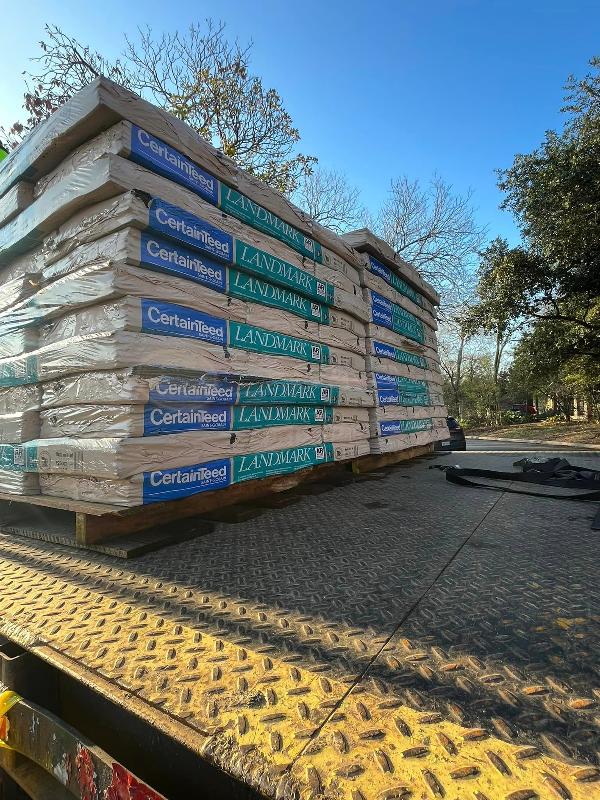 Stacks of Landmark shingles on pallets.