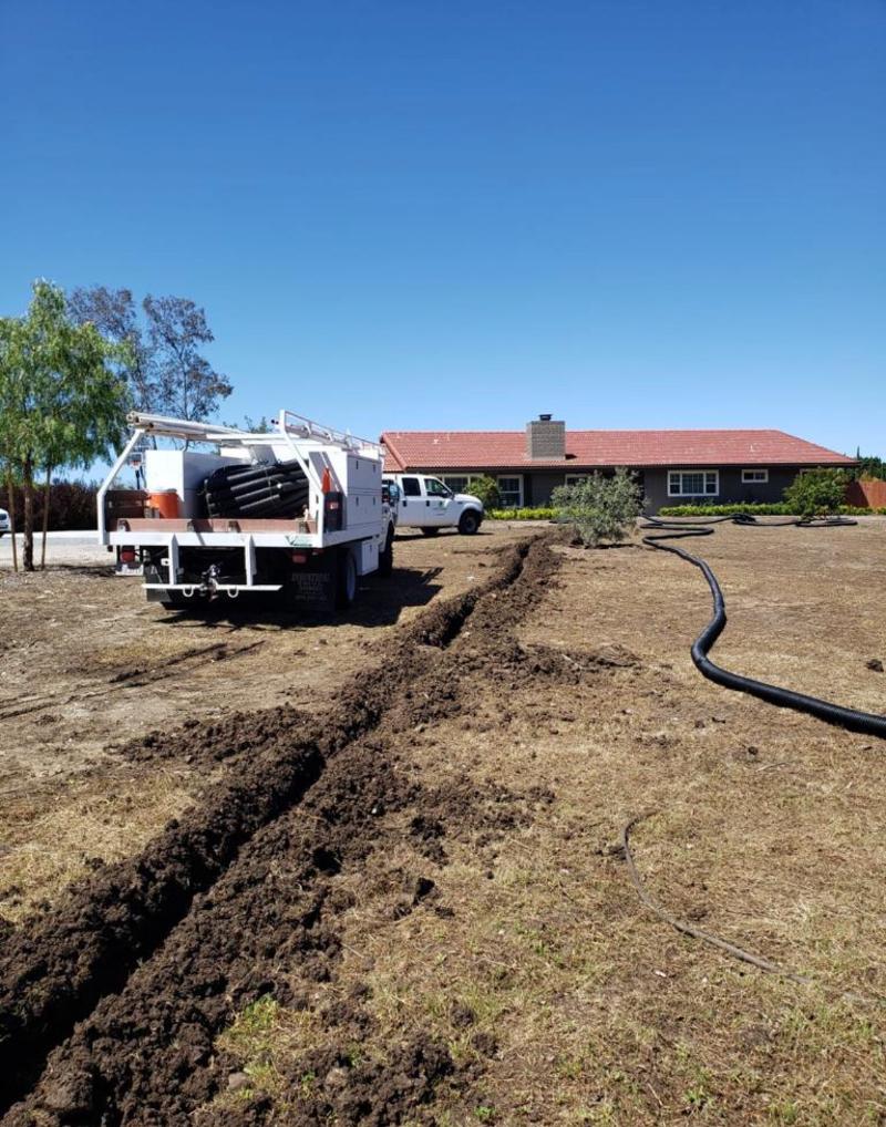 Crews laying pipes for an irrigation system.