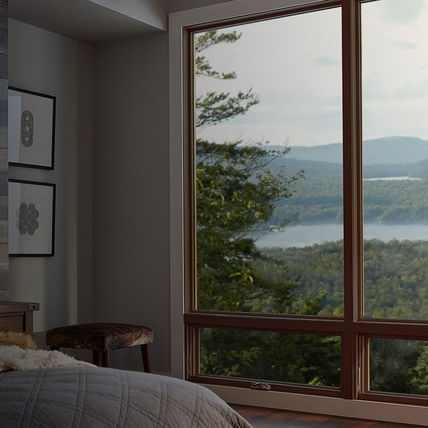 Windows overlooking a mountain view.