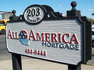 An address sign for All America Mortgage.