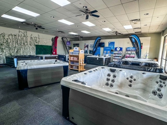 A display room full of a variety of hot tubs and spas.