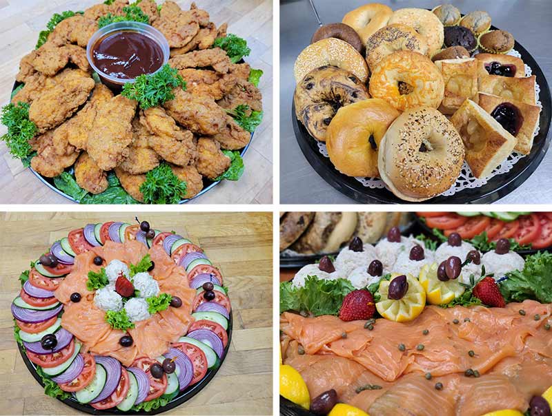 Four display trays of fried chicken, bagels, cold cuts, and salmon.