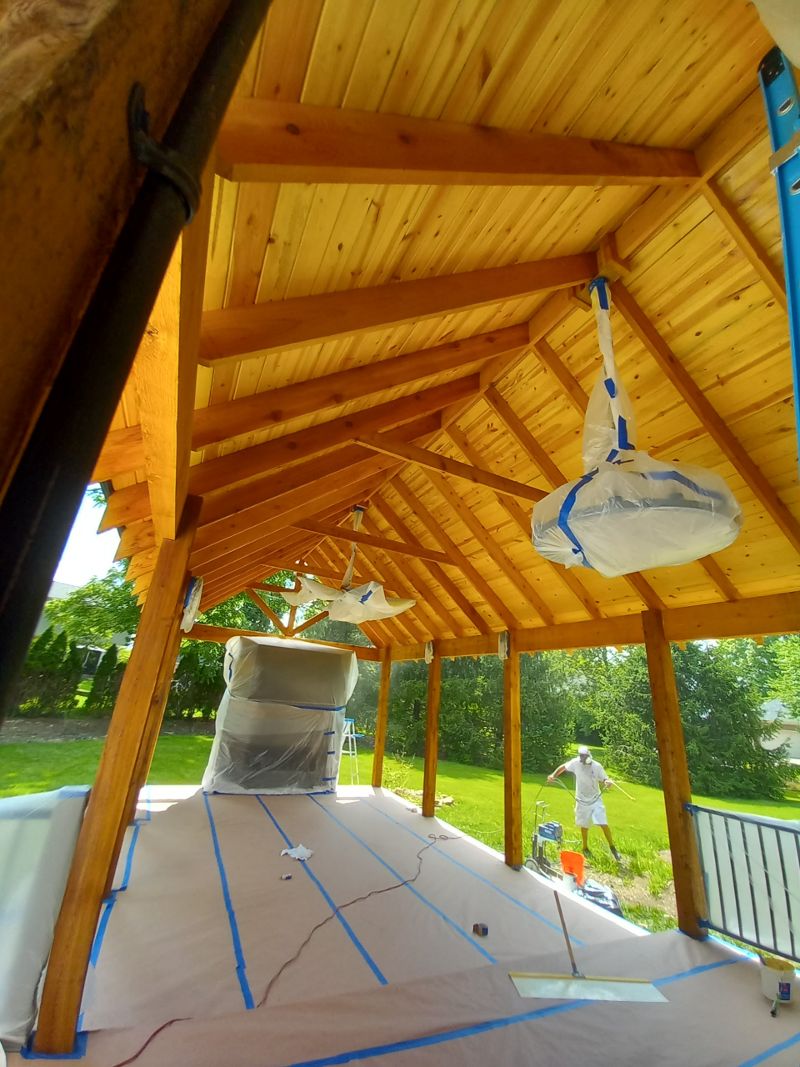 Looking up at a long, wooden breezeway.