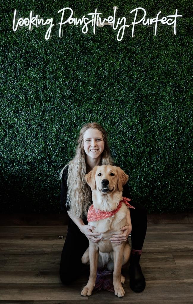 McKynsie posing with a dog