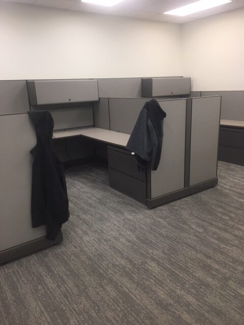 Desk cubicles next to a wall.