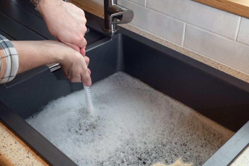 Man testing a drain.