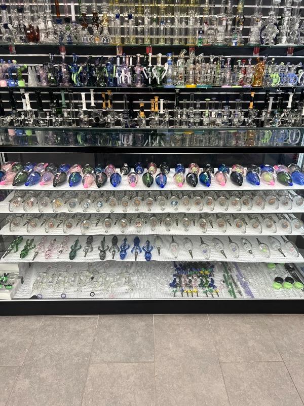 Huge assortment of pipes and glassware.