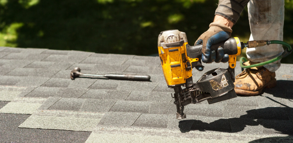 man doing roof repair