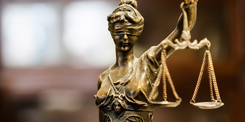 Straight-on shot of Lady Justice statuette.