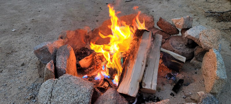 A campfire with burning logs.