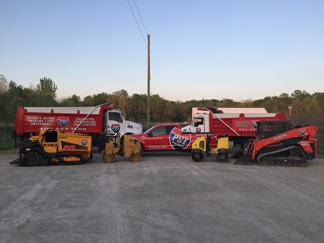 PSI Paving equipment sits in a parking lot.