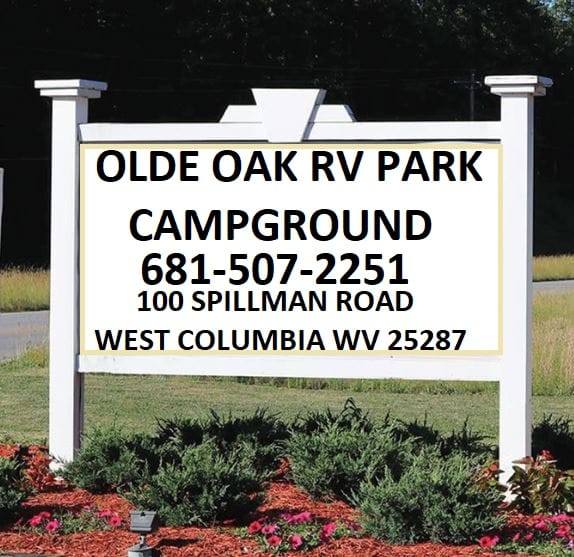 A welcome sign for Olde Oak RV Park and Campground.