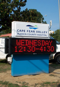 Outdoor signage for Cape Fear Valley Bladen County Hospital with an LED message screen.