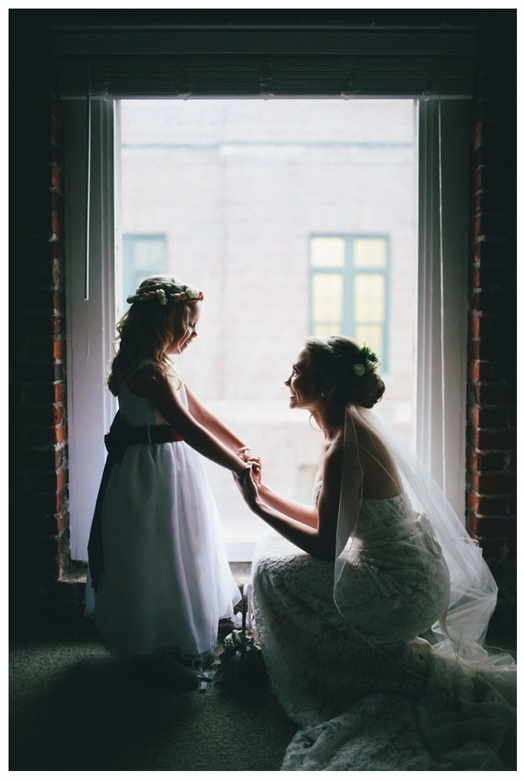 A young bride and her flower girl prepare for the big event