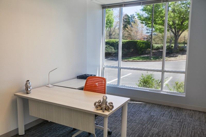 An exterior office with a sliding glass door.