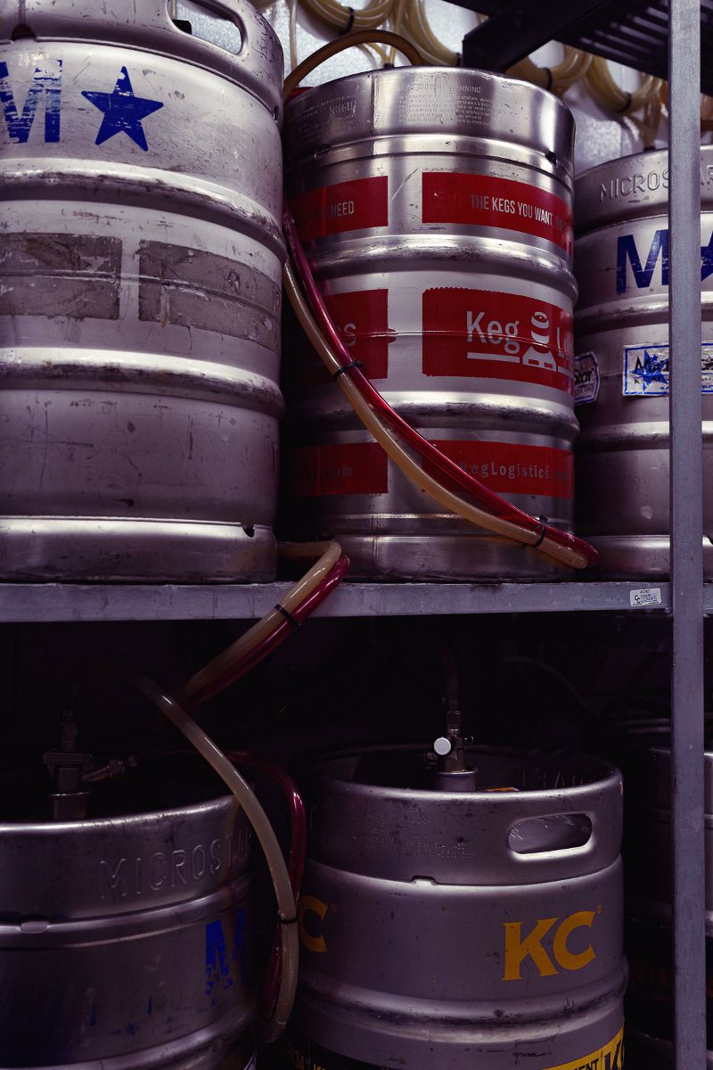 Kegs of beer on a storage shelf