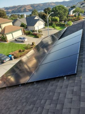 Solar panels on a shingle roof.