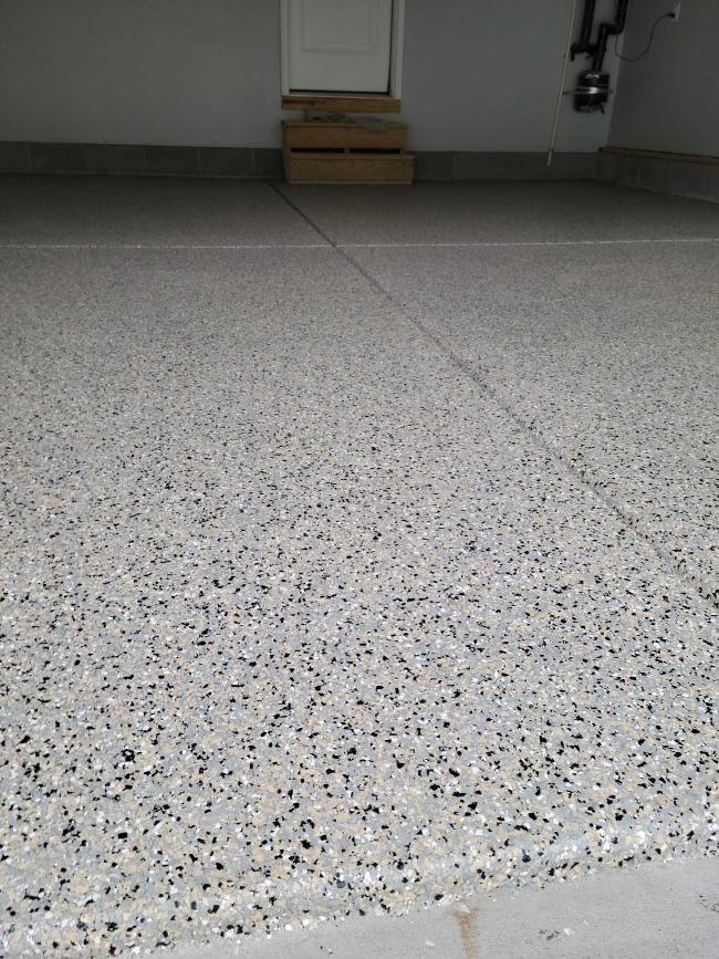 A garage floor with epoxy flooring.